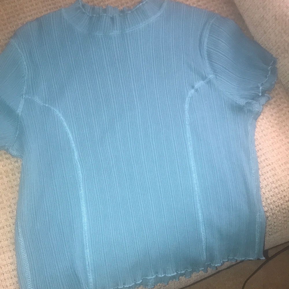 teal colored crop top with ruffles detailing.